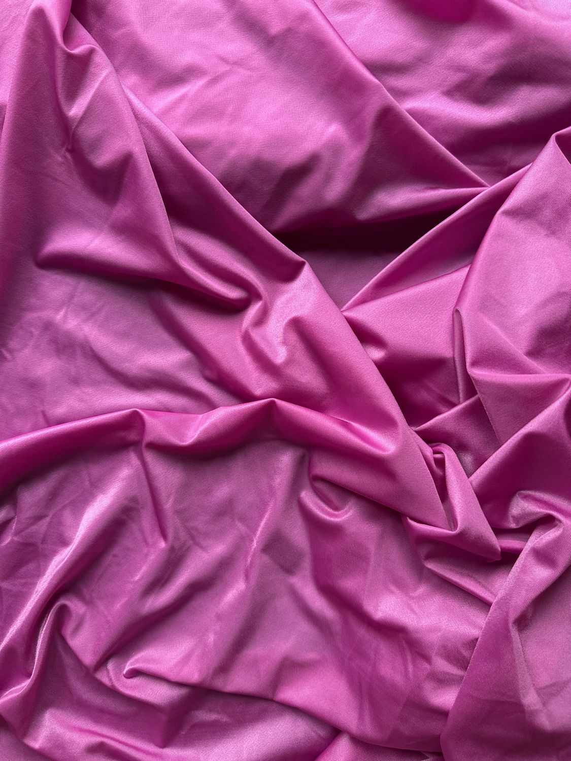 Satin Fuchsia stretch microfiber fabric with subtle sheen for lingerie sewing.