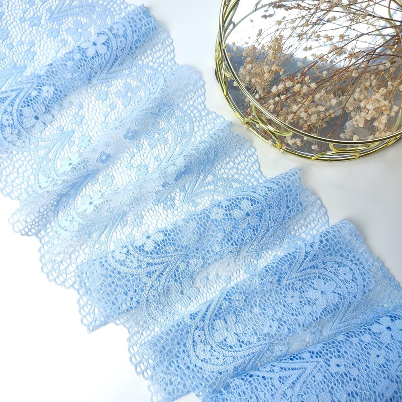 Light blue stretch lace with floral pattern and scalloped edges