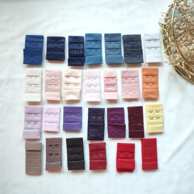 Hook and eye closures for lingerie, assorted colours