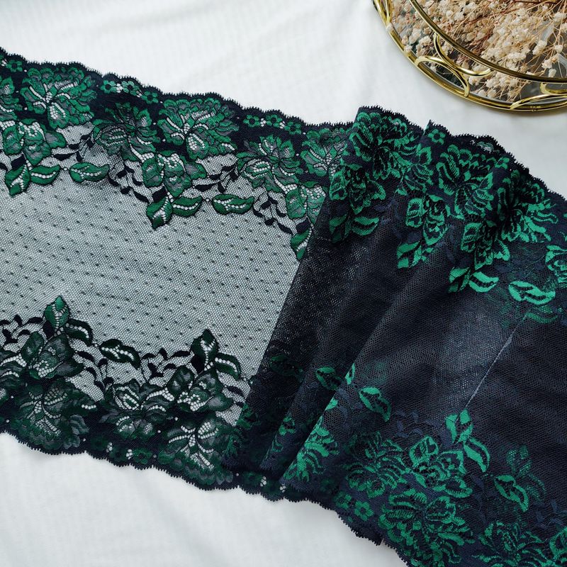 Black stretch lace with green iridescent embroidery

