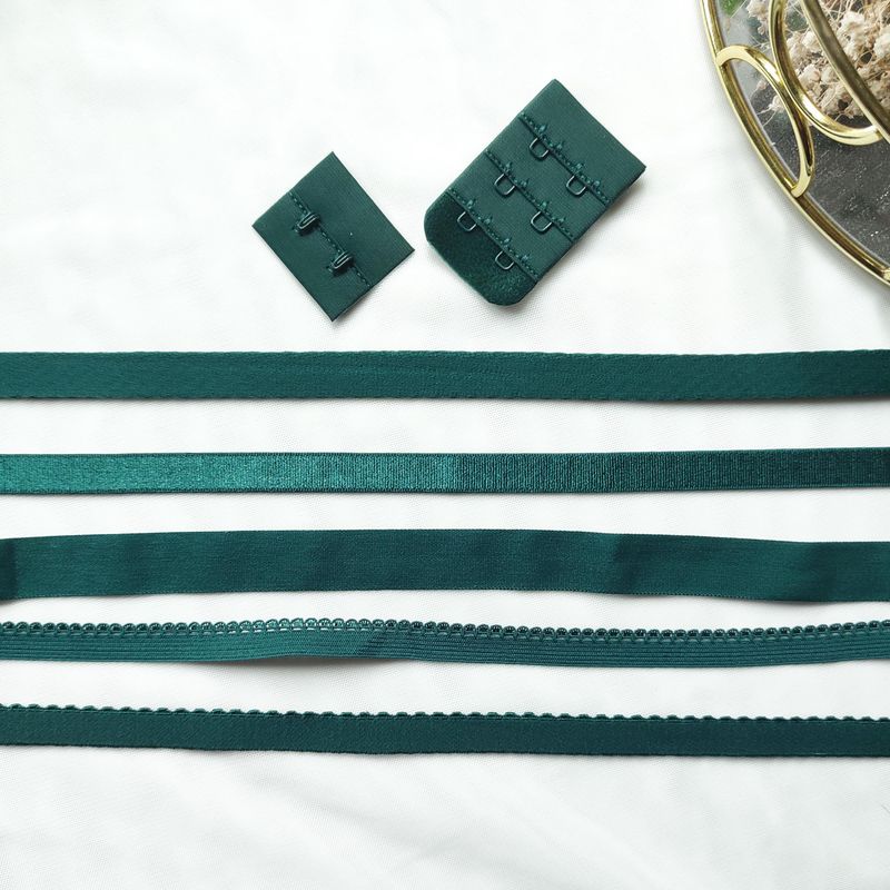Dark green lingerie elastics in various widths and styles for lingerie sewing

