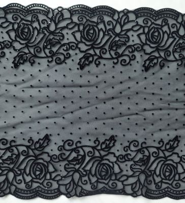 Dentelle extensible noire avec motif floqué – effet velours luxueux