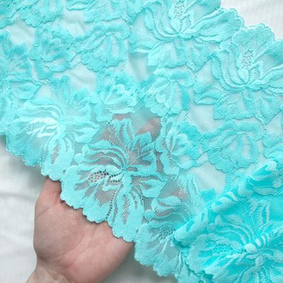 Colorful wide stretch lace with floral pattern in multiple bright colors


