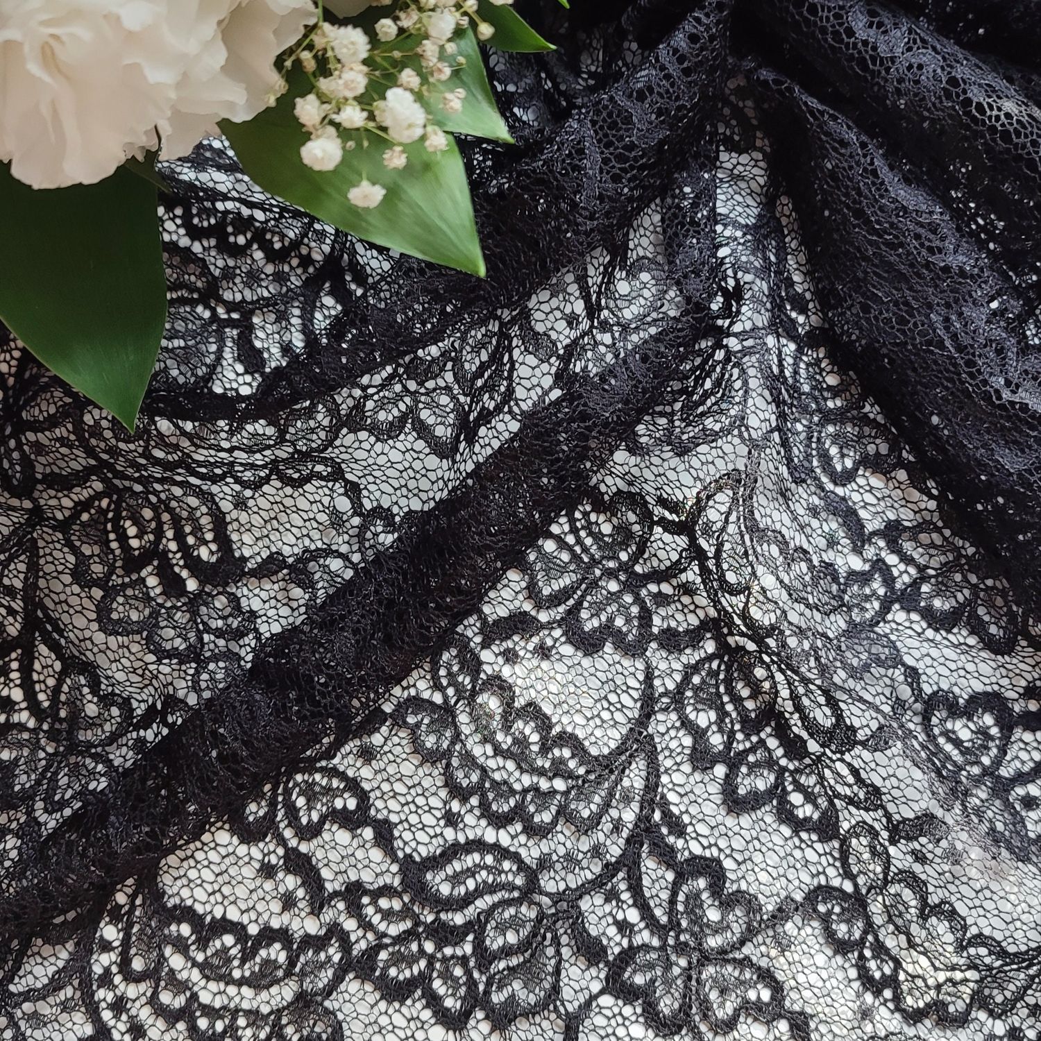 Black guipure lace fabric with floral pattern, 145cm (57.1") wide