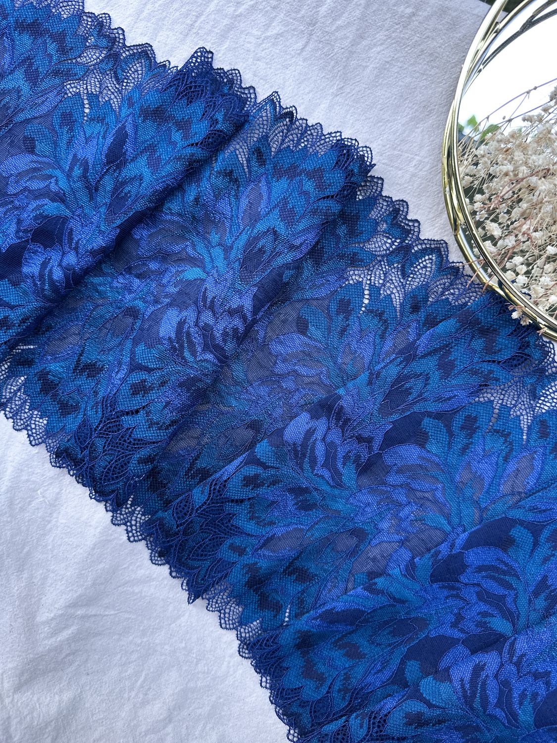 Gradient blue floral stretch lace in navy, cornflower, and teal for lingerie

