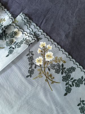 Khaki floral embroidery lace on beige mesh

