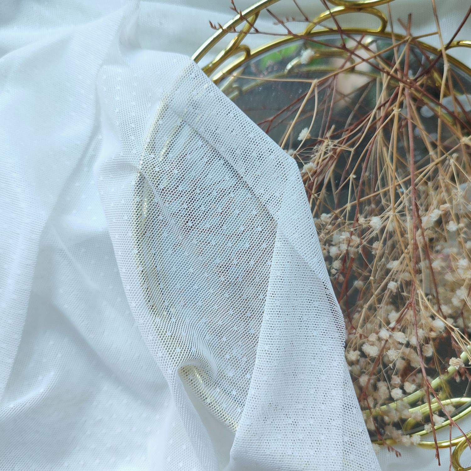 Ivory dotted stretch mesh fabric for lingerie sewing, semi-sheer soft tulle with small dots.