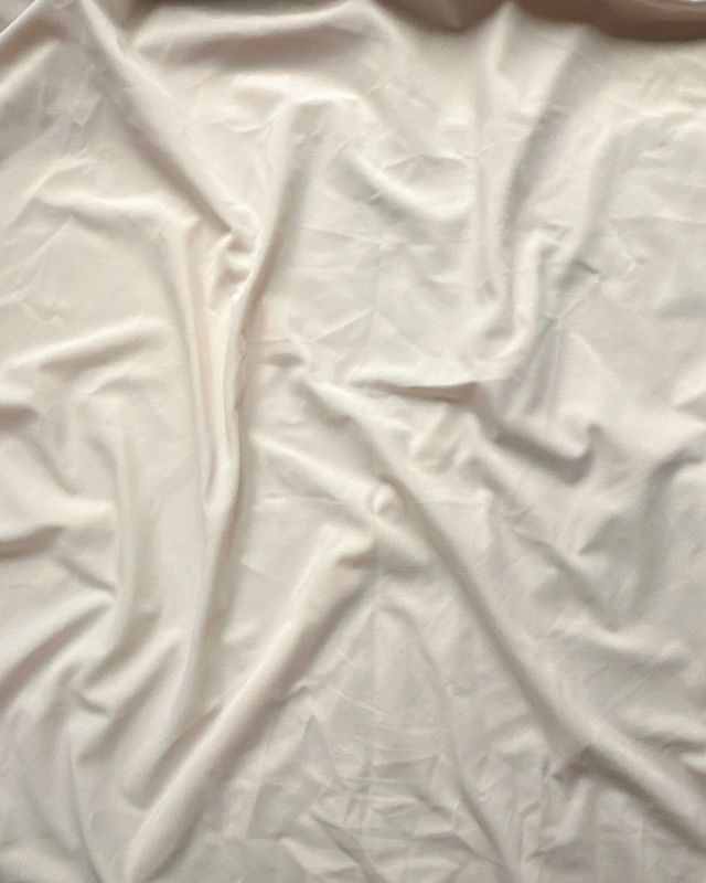 Soft cream stretch microfiber fabric — smooth matte surface