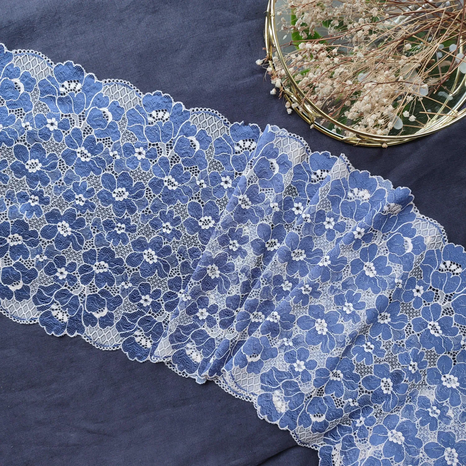 beige lace with blue floral pattern and scalloped edges