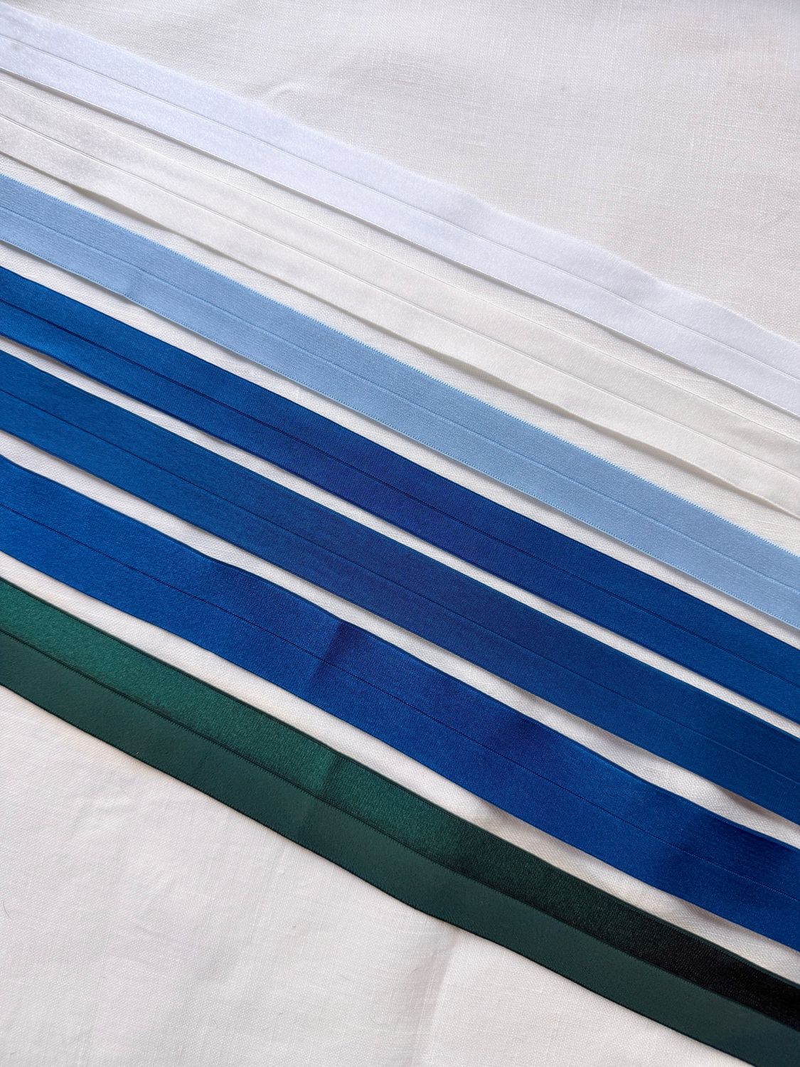 Satin fold over elastic fabric