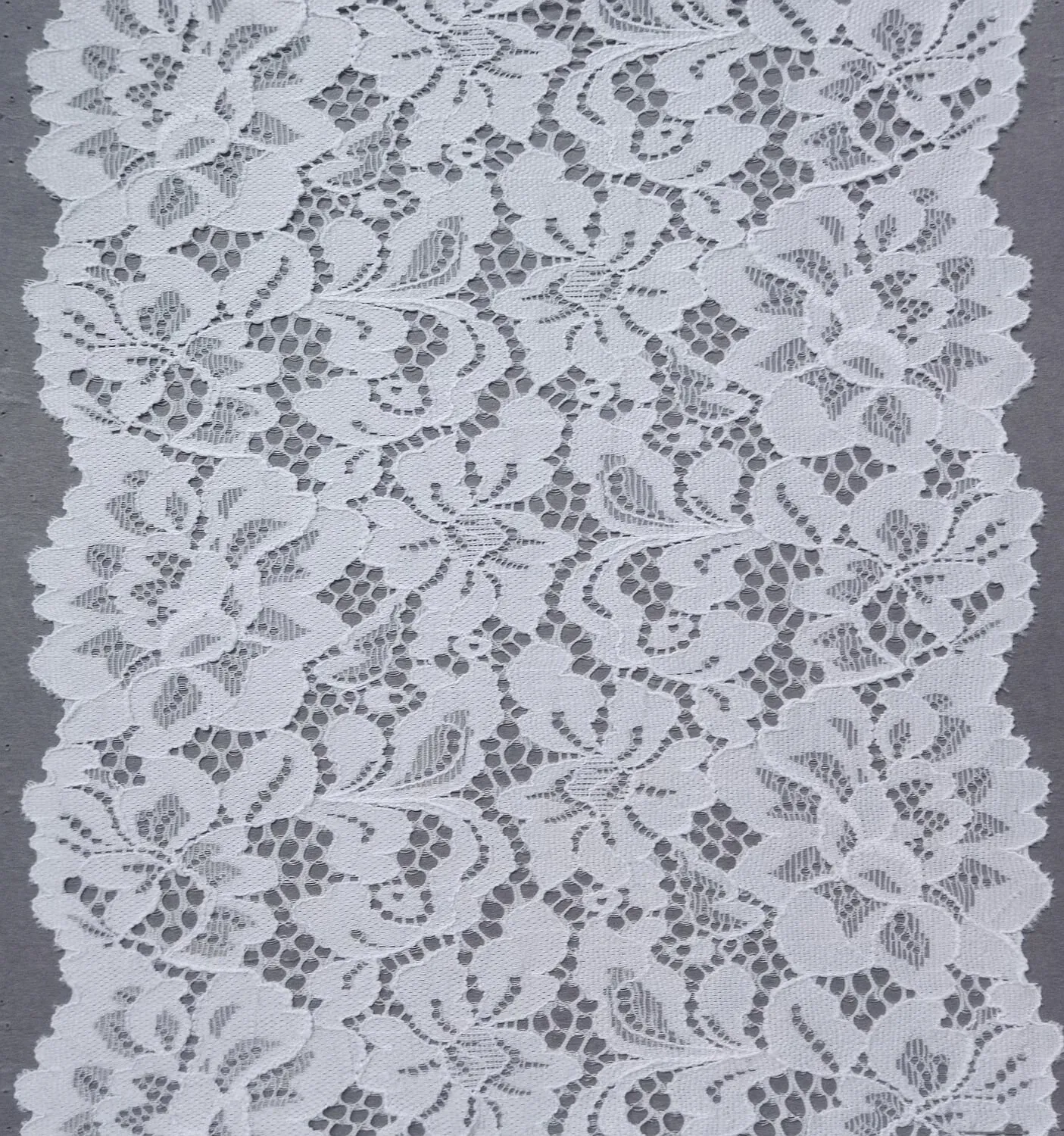 White floral stretch lace trim with openwork leaves and two scalloped edges, 19 cm wide