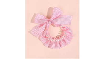 Pink bow dress with satin bodice (flat lay)