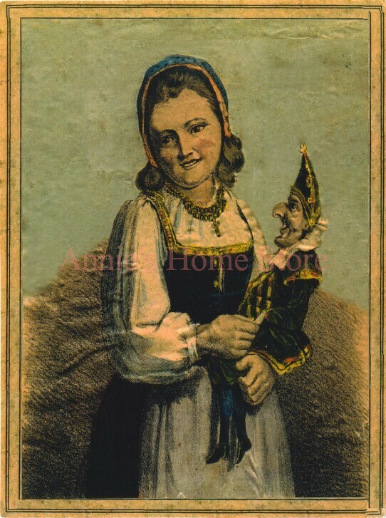 Girl holding a puppet.