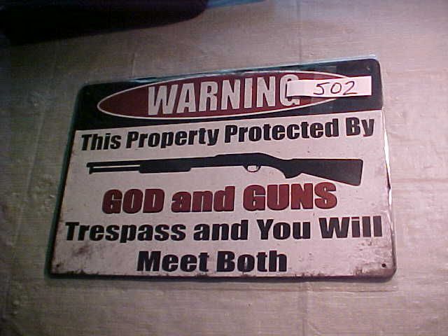 # 502 - WARNING Protected By God And Guns Trespass And Meet Both Metal Sign - Sign Size: 8&quot; x 12&quot;