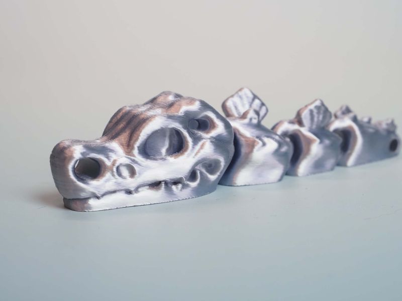 Czaszka dinozaura - brelok - srebrny