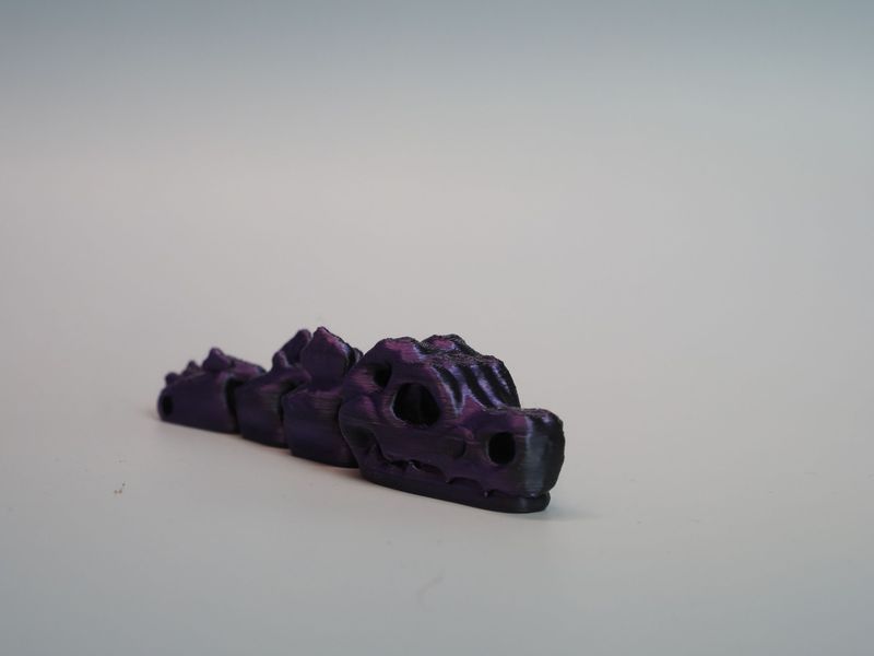 Czaszka dinozaura - brelok - fioletowy