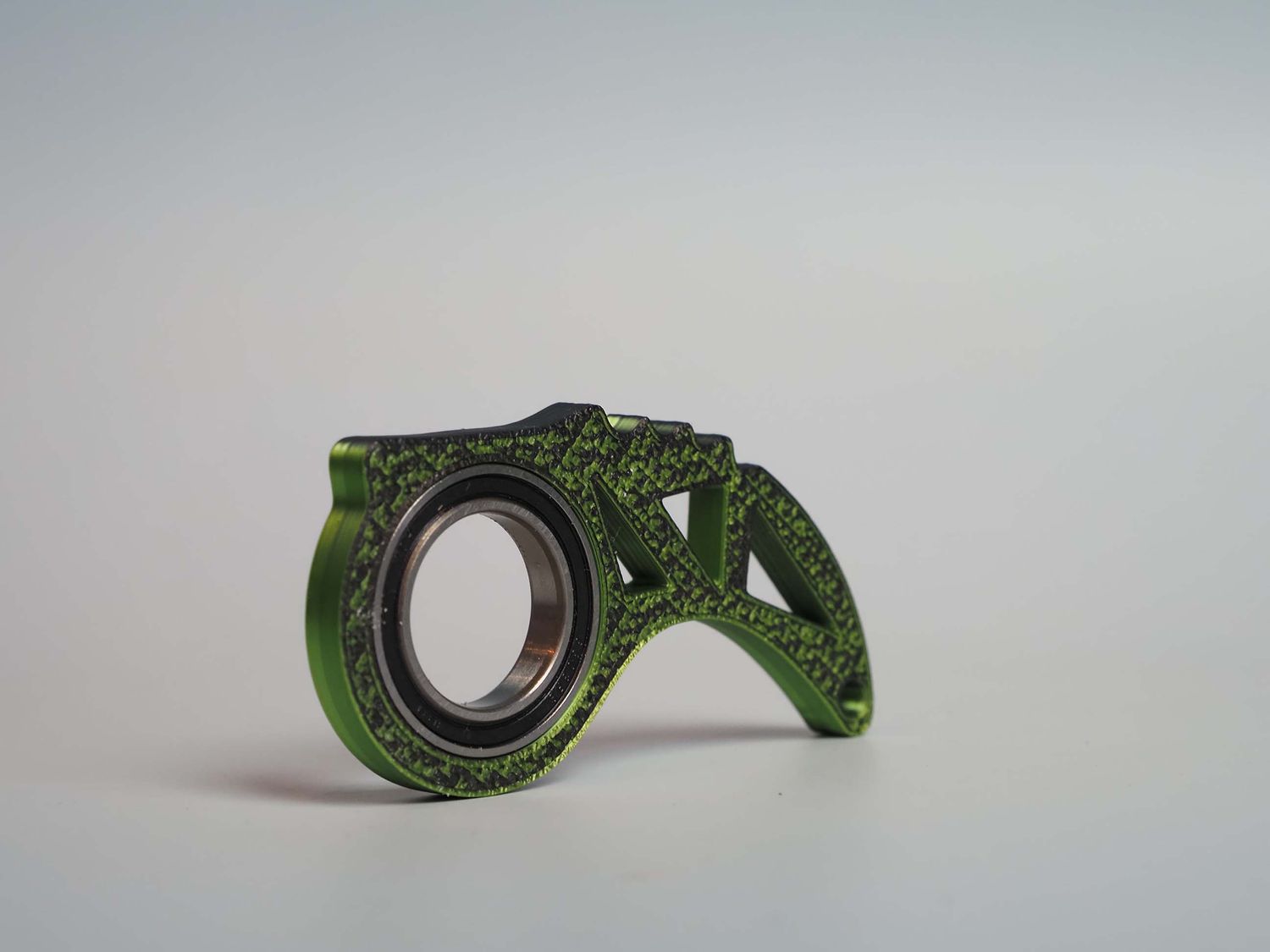 ​Keyrambit – brelok obrotowy z łożyskiem - zielony