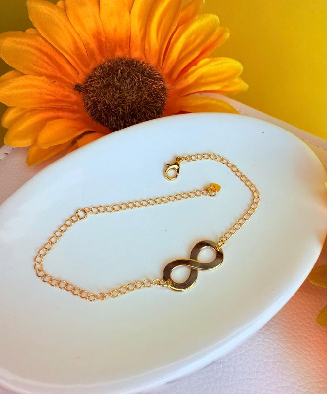 PULSEIRA INFINITO LISO BANHADA A OURO 18K.