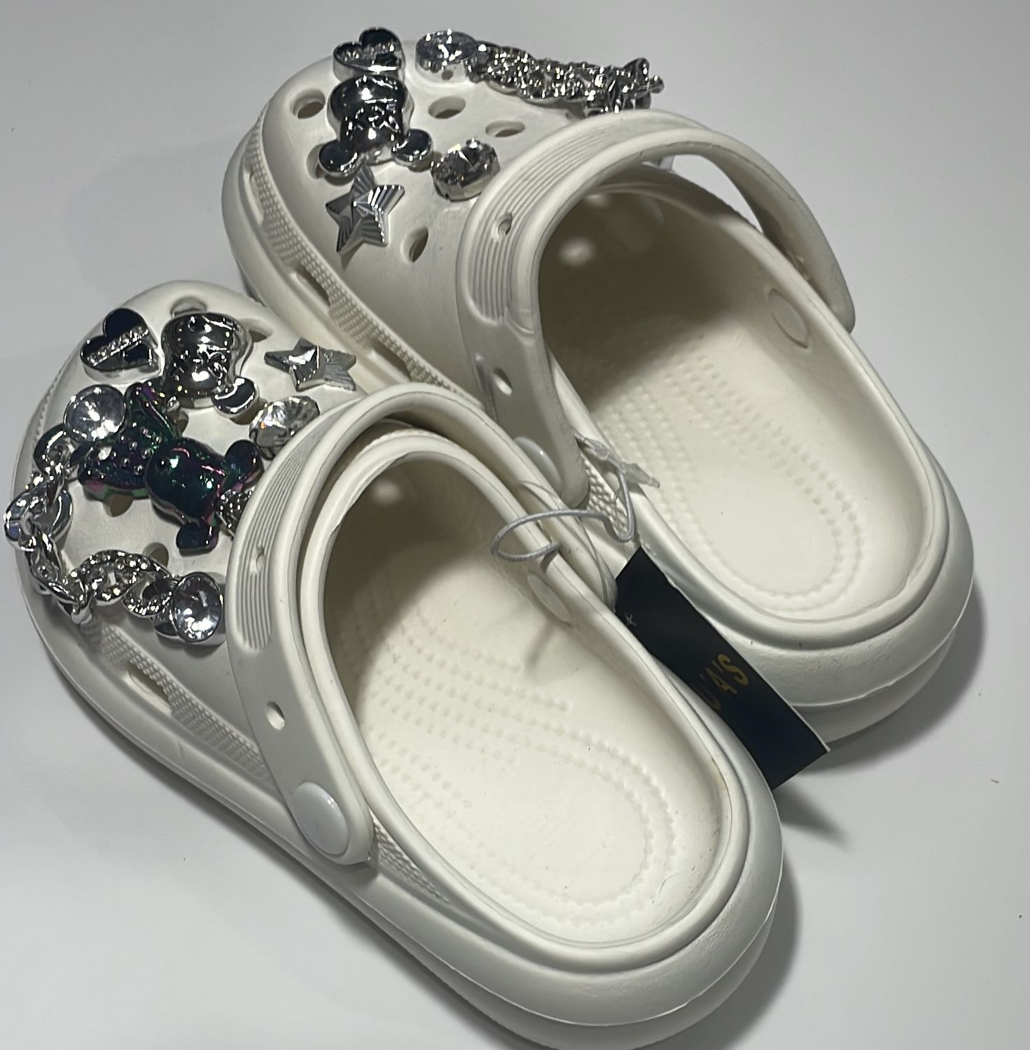 CROCS ONE IN BLACK, ONE IN WHI