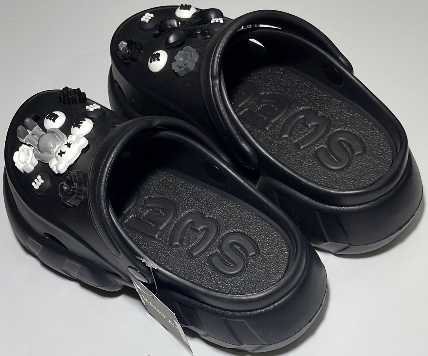 CROCS ONE IN BLACK AND ONE IN