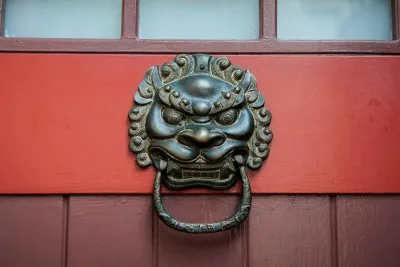Dragon face door knocker to show the Pre-enforcement asset check service
