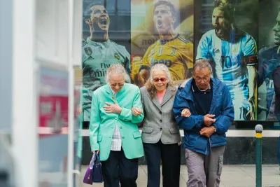 Three old pensioners at a bus stop to show the Long lost friend tracing service