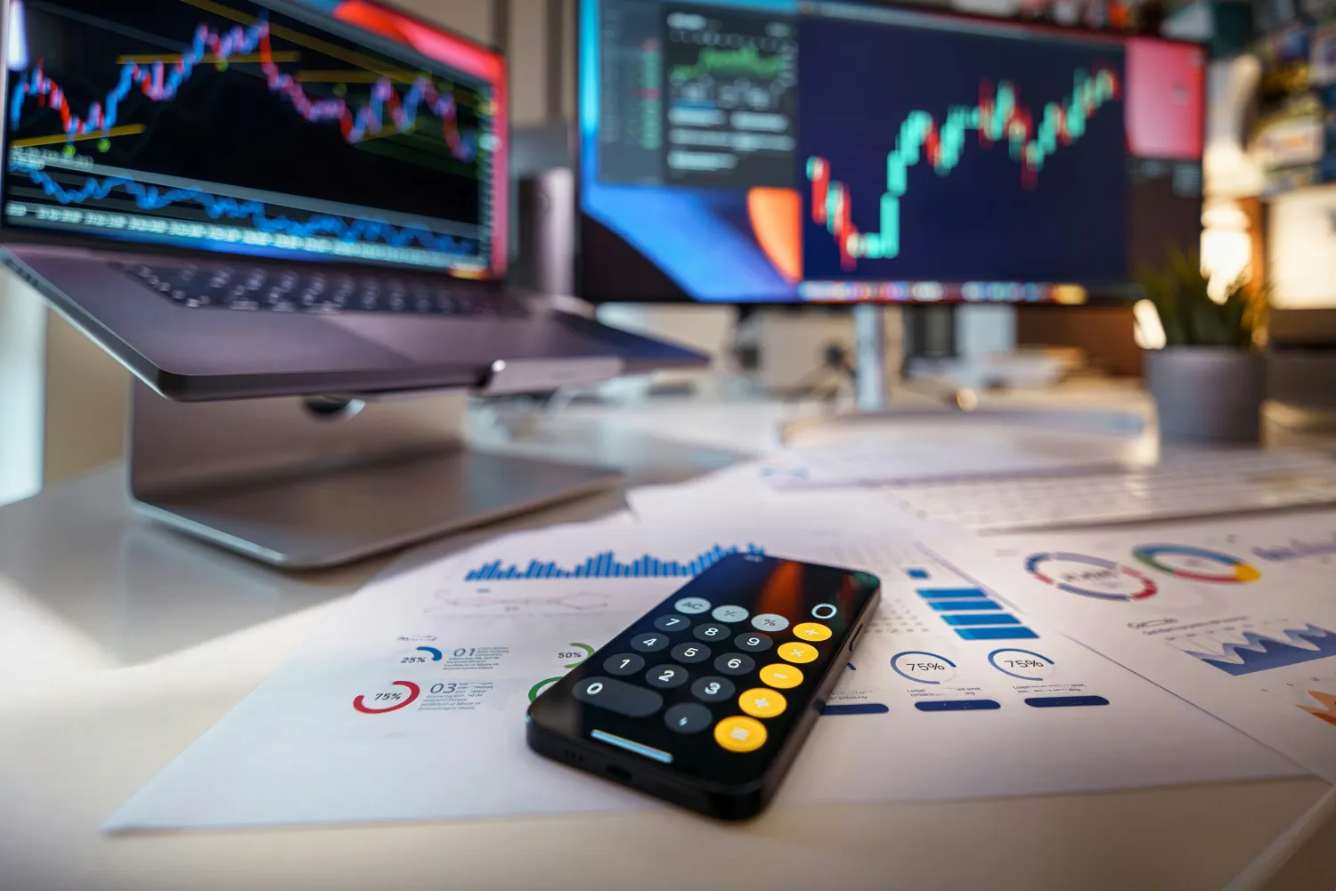 Computer with report and phone to show the Debtor asset and liability search 