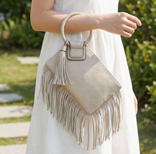 Oatmeal vegan leather fringe clutch.