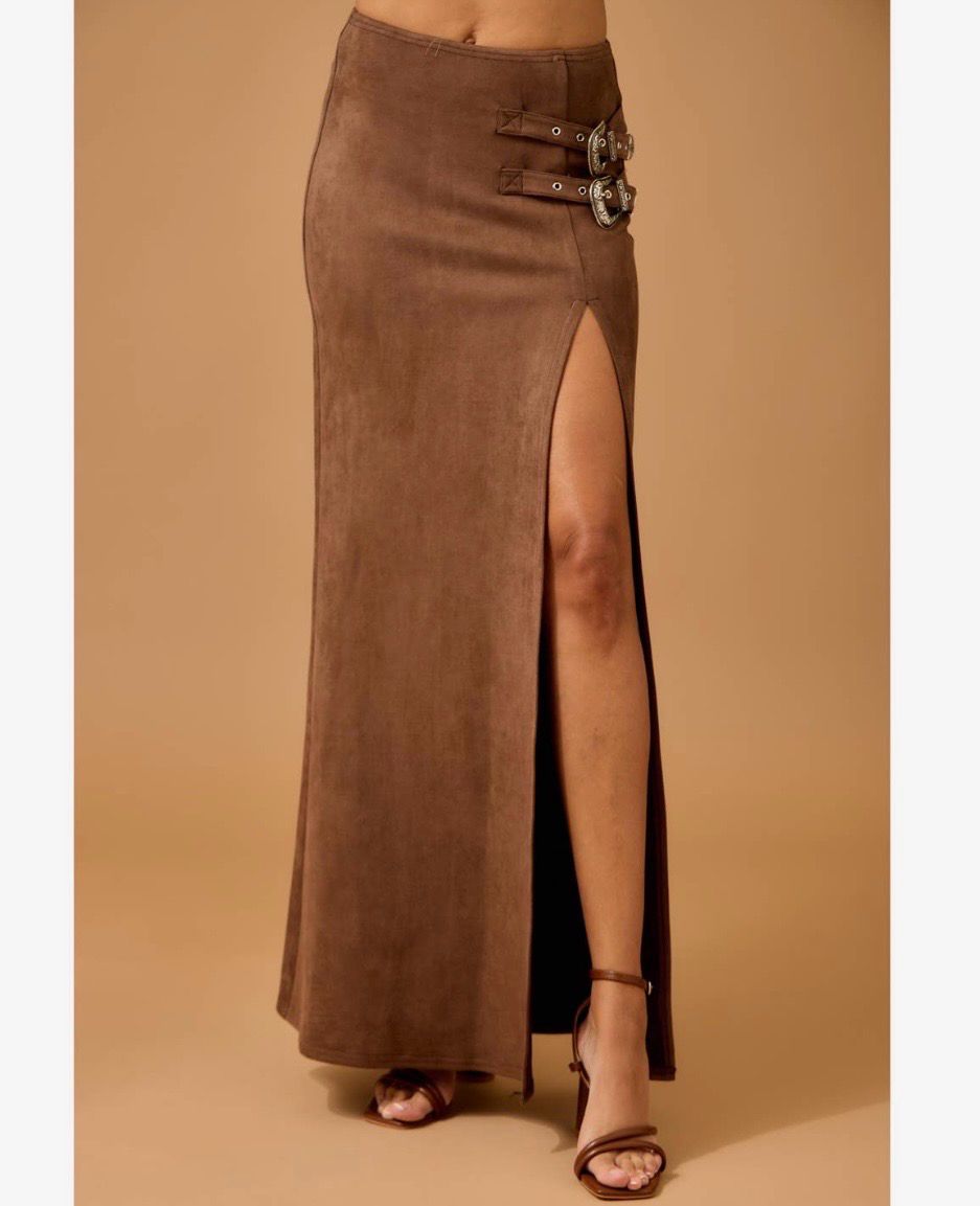 Model wearing brown Western faux suede maxi skirt with high slit and heels. 