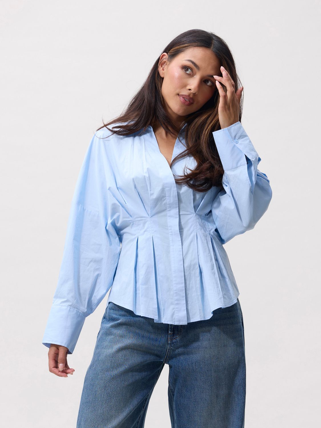 Blouse with waist pleats