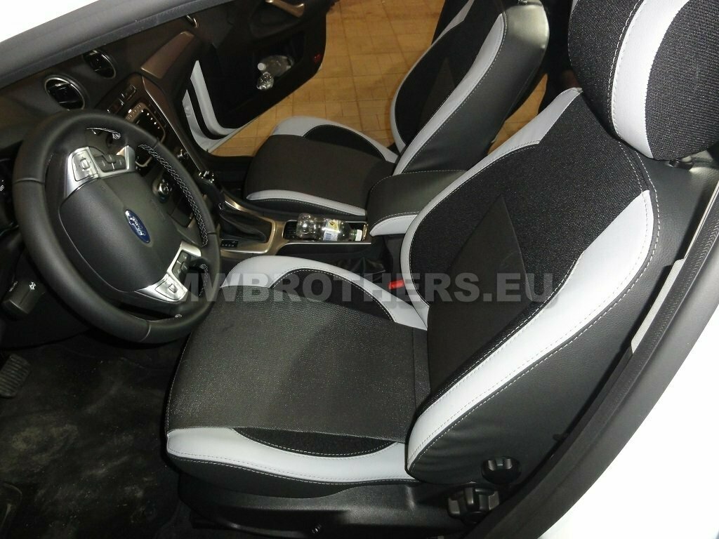 Comfort series with white stitching and black textile and white leather