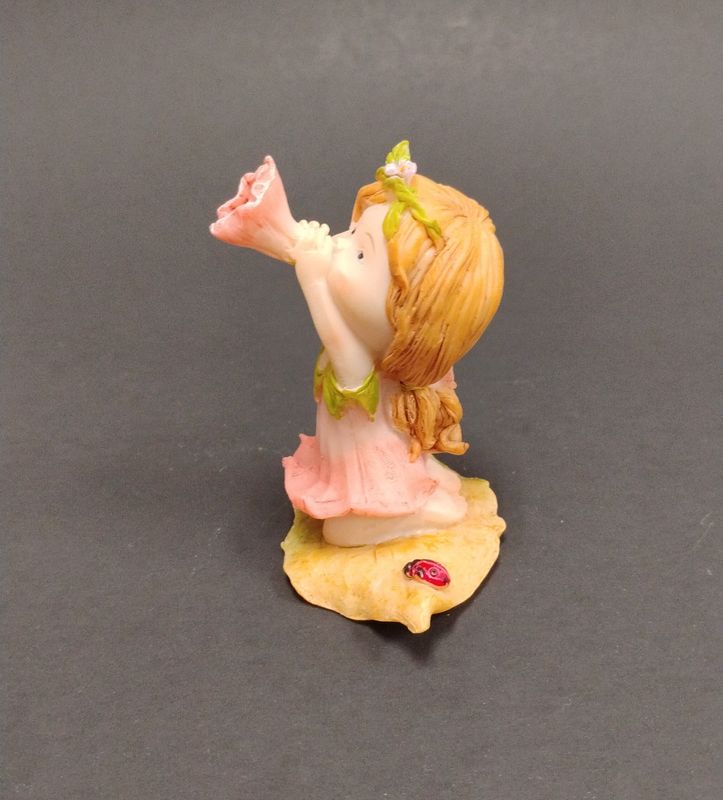 Little Fairy Blowing Flower Statue