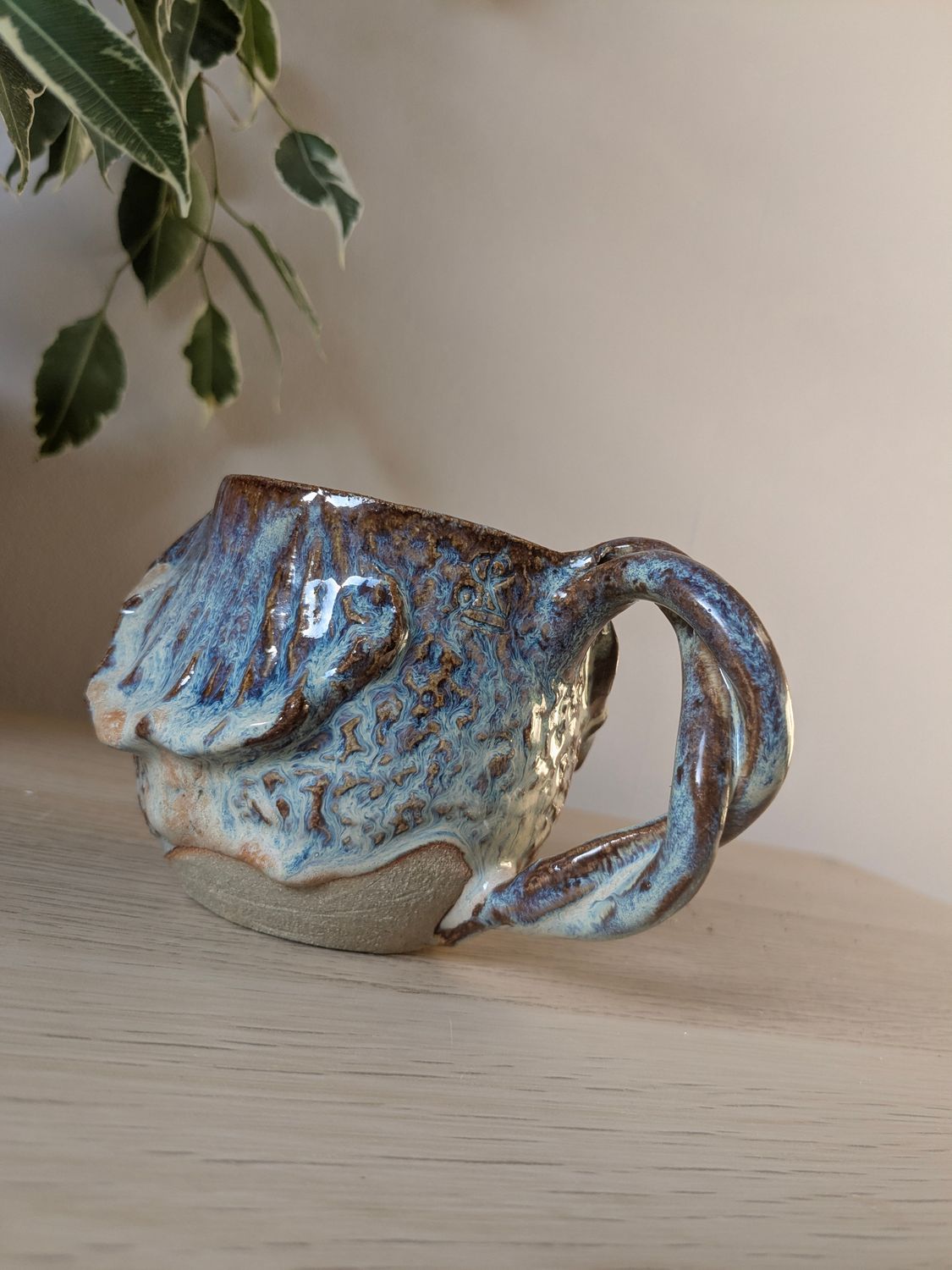 Milk jug with waves and a twisted handle