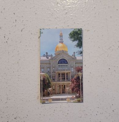 A magnet featuring a photograph of the State House Capitol in Trenton, NJ