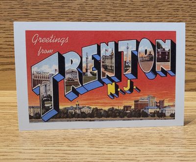 A postcard that says 'Greetings from Trenton' in a vintage font, featuring a red sunset with the Trenton skyline.