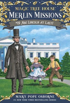 The cover of 'Abe Lincoln At Last', featuring Abe Lincoln and two children standing in front of the White House.