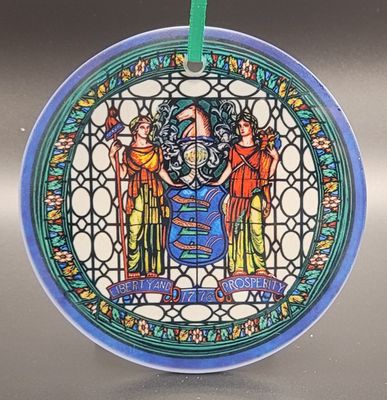 A stained glass ornament featuring the Great Seal of New Jersey from the New Jersey State House