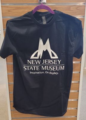 A black T-shirt with the New Jersey State Museum logo, name, and slogan (Inspiration. On display).