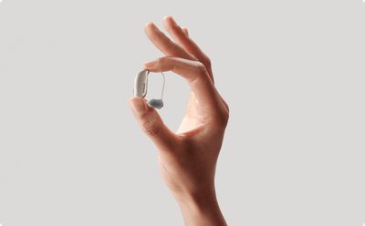 ReSound Sensia microRIE hearing aid held in hand