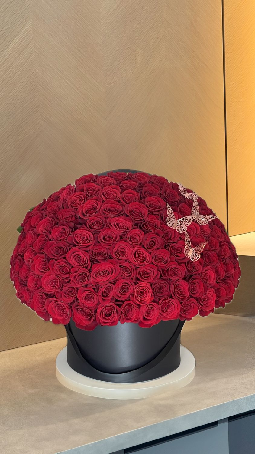 Red rose dome in black round box with decorative lace butterflies – luxury flower delivery Miami &amp; Naples