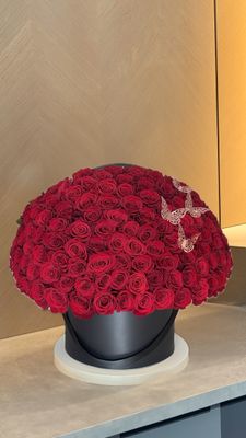 Red rose dome in black round box with decorative lace butterflies – luxury flower delivery Miami &amp; Naples