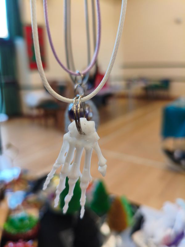 SKELETAL HAND PENDANT