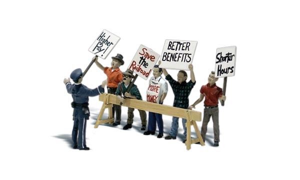 N Picket Line - 5 Workers Protesting Behind Barricade with 1 Police Officer