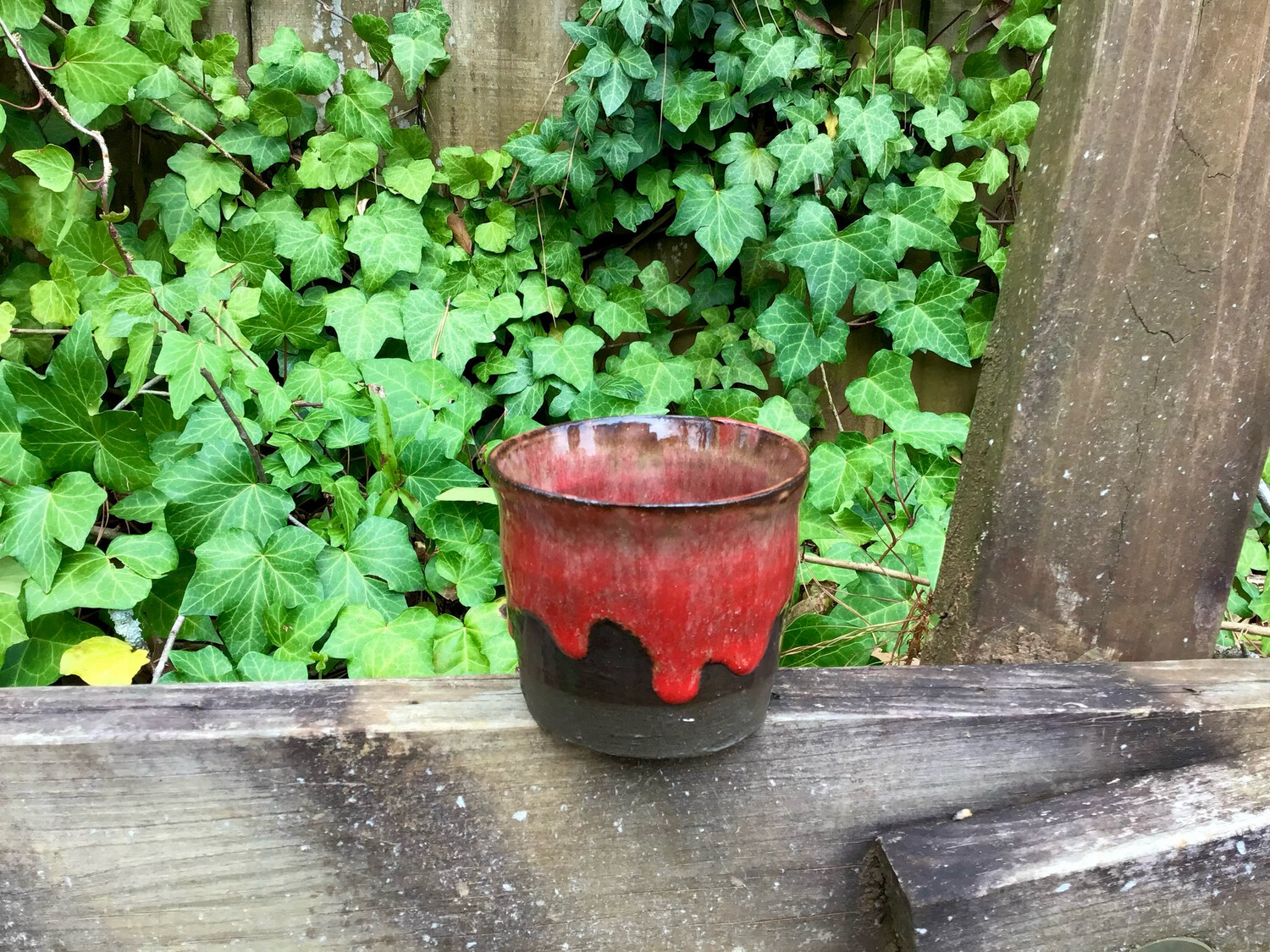 small red drip cup