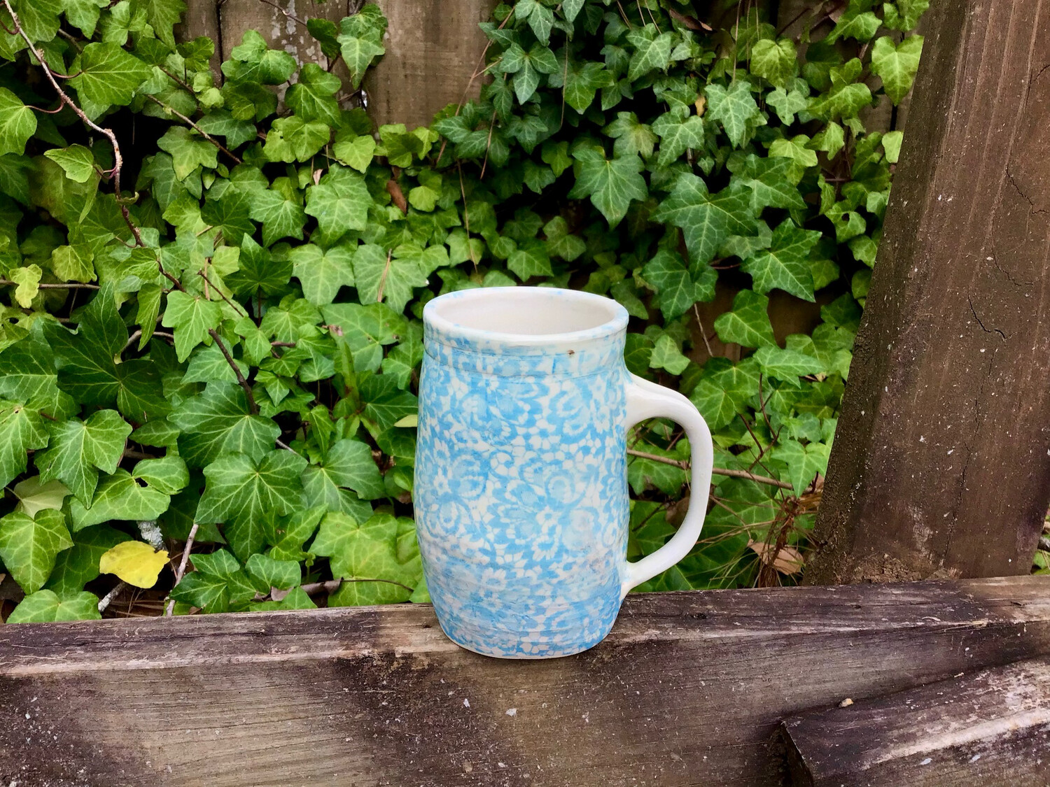 large light blue flowered mug