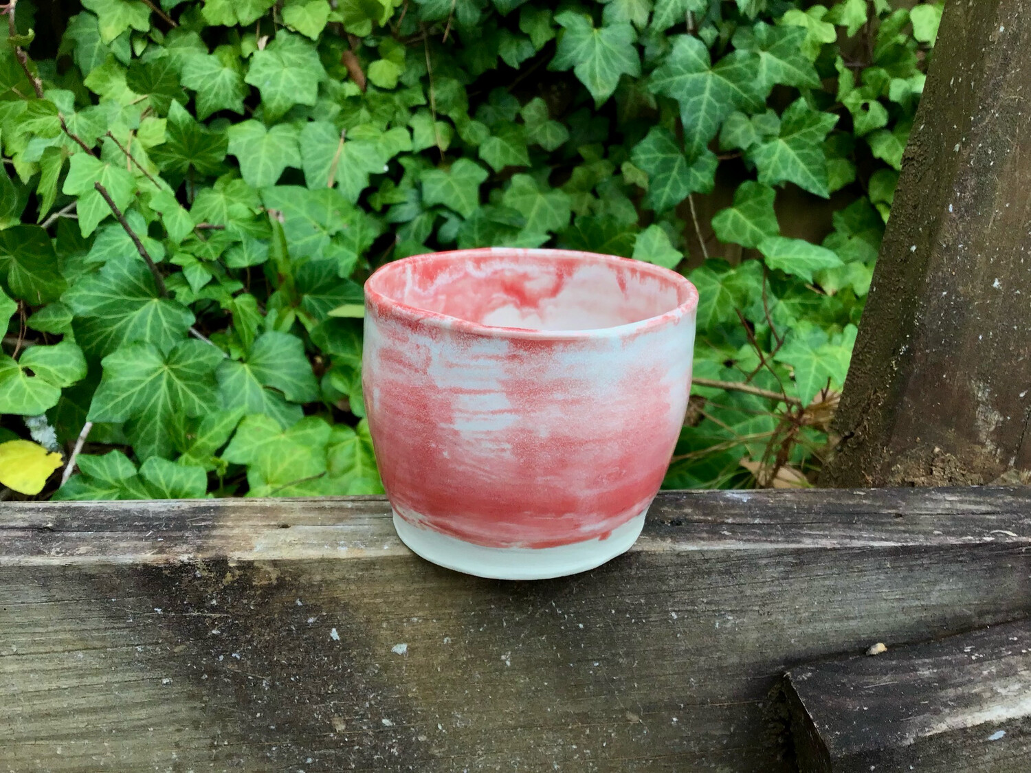 small white and red cup