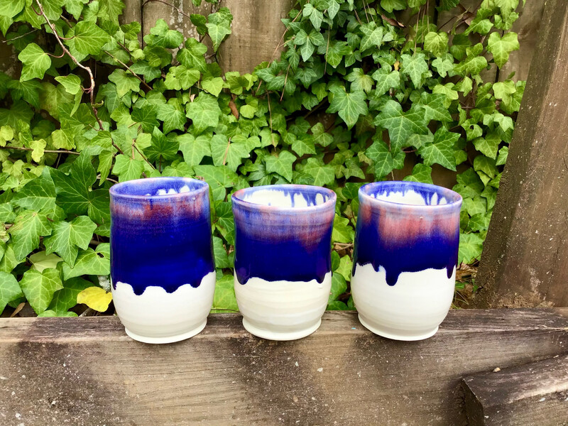 set of three cups with dark blue/pink drips