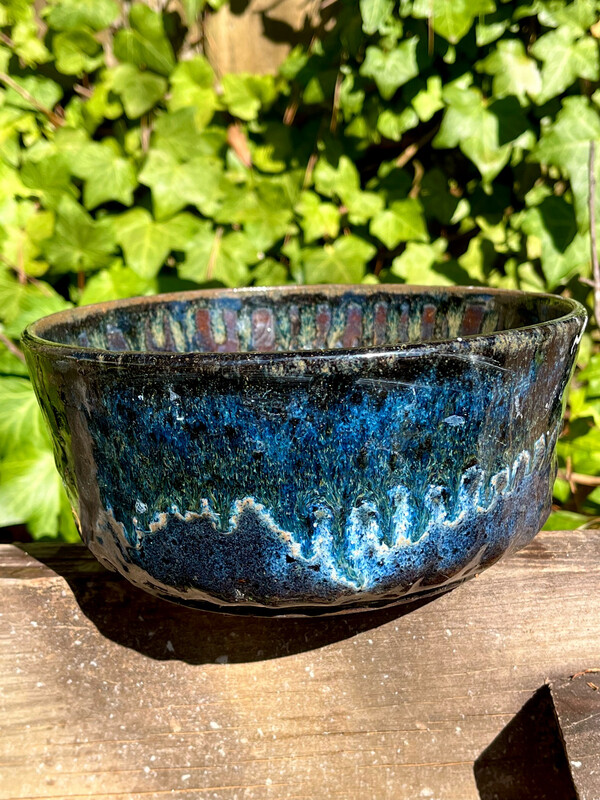 large dark blue bowl with small chip on the bottom