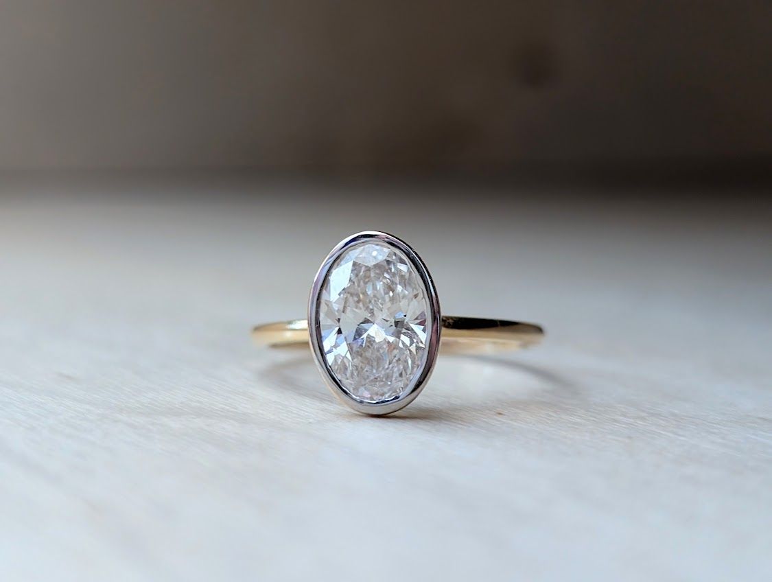1.51 Carat E/F VS Oval Diamond Solitaire Bezel in 14k Yellow Gold Size 7