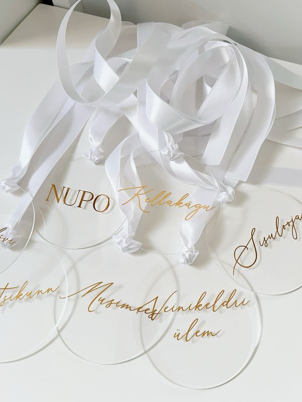 Pulma ametimärgid pleksiklaasist foil kuldse teksti ja valge paelaga